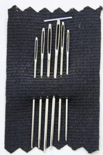 Six round point embroidery needles